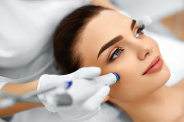 Face Skin Care. Close-up Of Woman Getting Facial Hydro Microdermabrasion Peeling Treatment At...