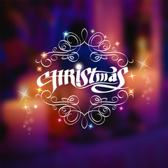 Christmas shiny lettering with curles pattern on blurred background with candles