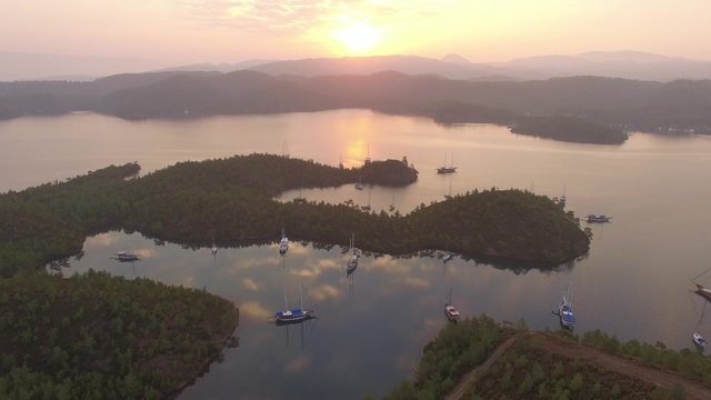 Epic aerial video of English Harbor in Gokova Gulf Bodrum Turkey during sunrise.