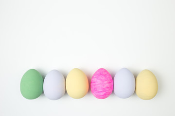 Easter eggs painted in pastel colors on a white background