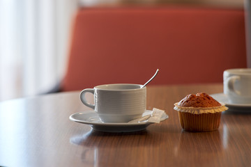 cup of tea and cake on the table