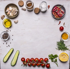 vegetables and seasonings, frame laid out on a white wooden background  top view 