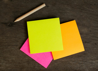 Colorful post it note on wood board