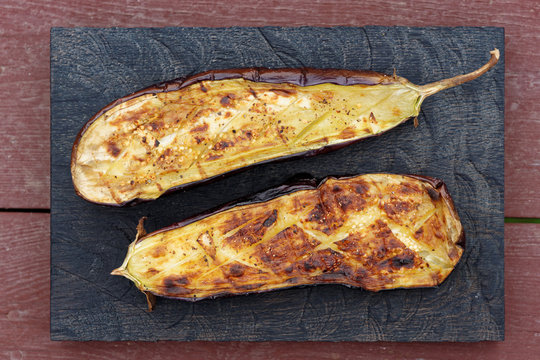 Grilled eggplant on wooden board