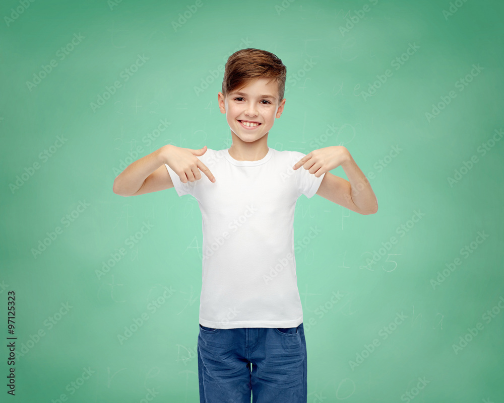 Wall mural happy boy pointing finger to his white t-shirt