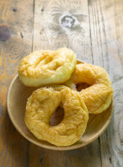 sugar donuts on rustic wood