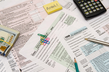 1040 Tax Form with pen, calculator