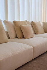 Stylish comfortable couch with curtaining