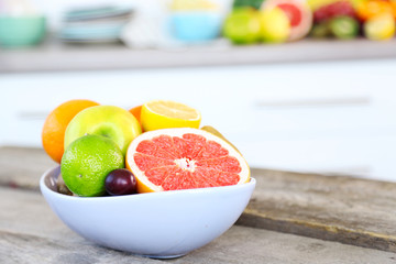 Fresh fruits on table in kitchen, close up