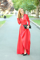 Beautiful young girl posing on city street