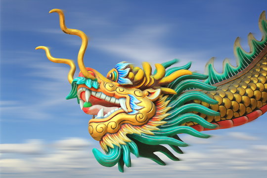 conceptual art : motion blur effect of china dragon statue fast forward movement in the sky