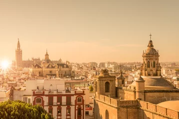 Fotobehang Aerial view of the roofs and the cathedral of Seville, Andalusia, Spain © Delphotostock