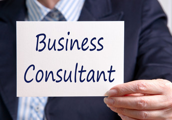Business Consultant - Manager holding sign with text