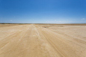 Fototapeta na wymiar Flat landscape in La Guajira with blue sky, Colombia