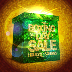 Boxing day sale with shiny gift box against gold mosaic backdrop.