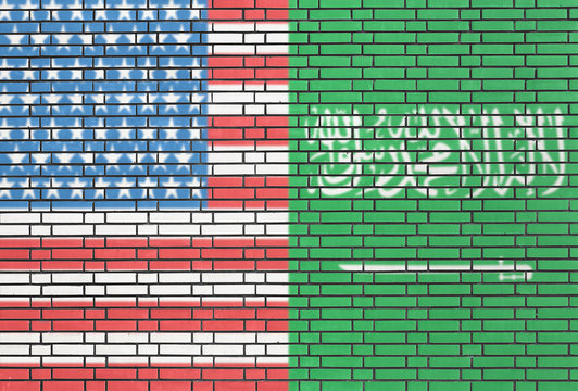 USA and Saudi Arabia flags on a wall