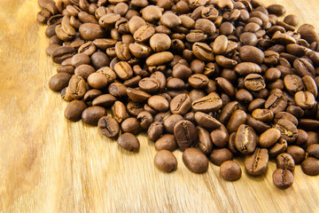 Coffee beans on vintage wooden board