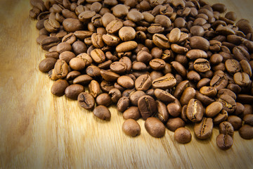 Coffee beans on vintage wooden board