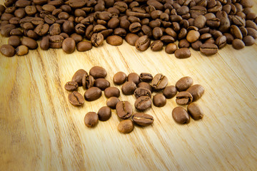 Coffee beans on vintage wooden board