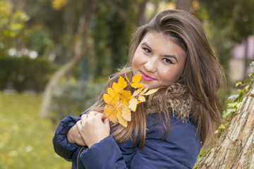 portrait of young woman in autumn Park