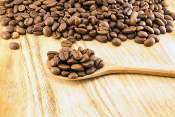 Coffee beans on vintage wooden board