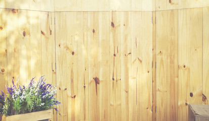 Wood background with flower decorated, vintage color tone.