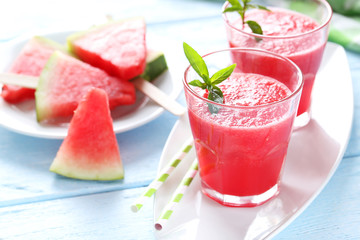 Fresh watermelon juice in the glass on wooden table