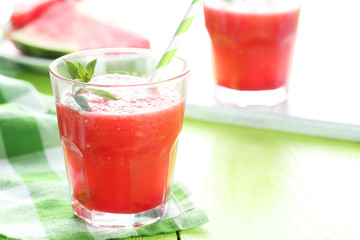 Fresh watermelon juice in the glass on wooden table