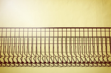 Warm light with shadows on wall.