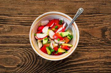 vegetable salad on a wooden background