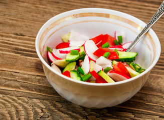 vegetable salad on a wooden background