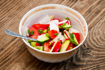vegetable salad on a wooden background
