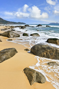 Tropical beach with rocks, Sanya, Hainan Island, China