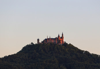 Obraz premium Hohenzollern castle in Germany at sunset.