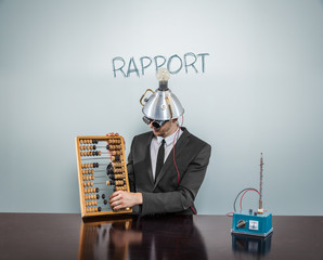 Rapport concept with vintage businessman and calculator