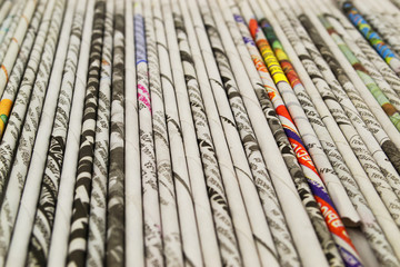Straws of colored newsprint
