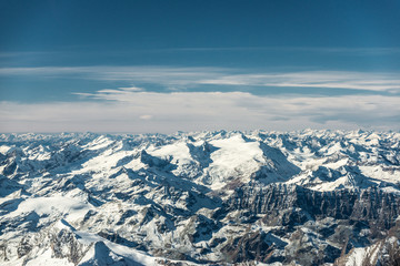 Fototapeta na wymiar aerial view to snowy mountain peaks in austria tyrol