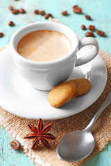 Cup of coffee on wooden table background