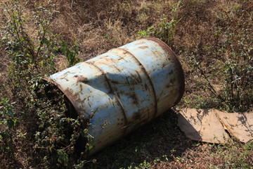 Old Damaged oil drum on ground