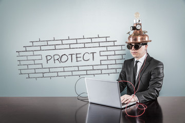 Protect concept with vintage businessman and laptop