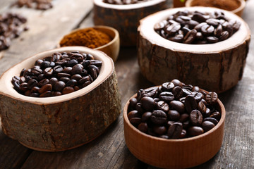 Collection of coffee beans on old wooden table, close up