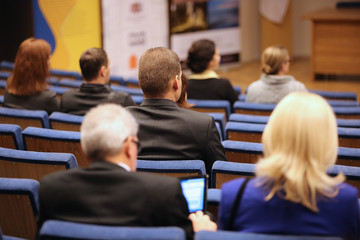 People at the conference hall. Rear view
