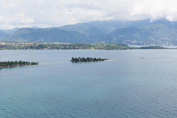 Lake Garda is the largest lake in Italy. It is located in Northern Italy, about half-way between Brescia and Verona, and between Venice and Milan.)