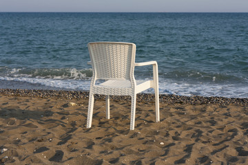white plastic beach chair photo