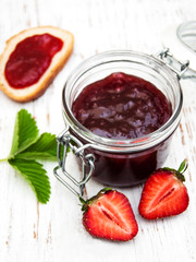 Strawberry jam and fresh strawberries