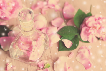 Rose oil in bottle on light background