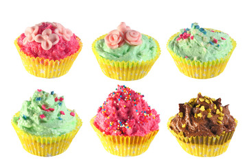 Sweet isolated cupcakes set with sprinkling and confectionery