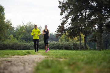 Fototapeta premium Young people running in the park