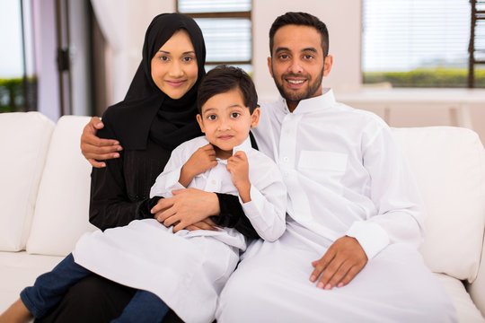 Muslim Family Sitting On The Couch