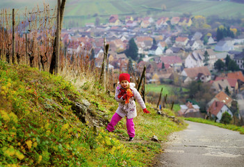 Obraz premium Cute little girl walking, autumn day